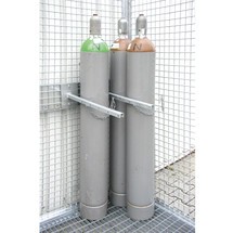 Dispositif de retenue pour caisse de stockage pour bouteilles de gaz